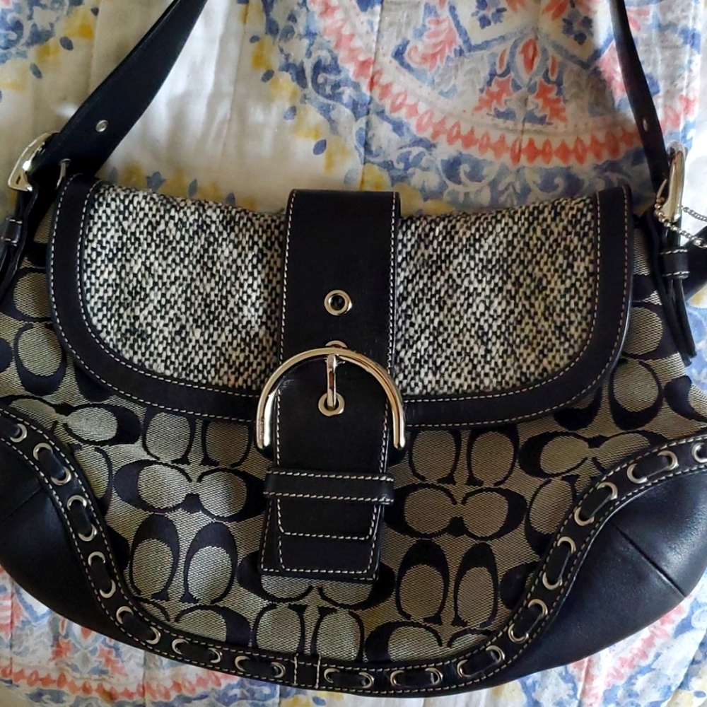 Coach HandbagCoach black and Grey purse. Light blue interior. Great Condition.